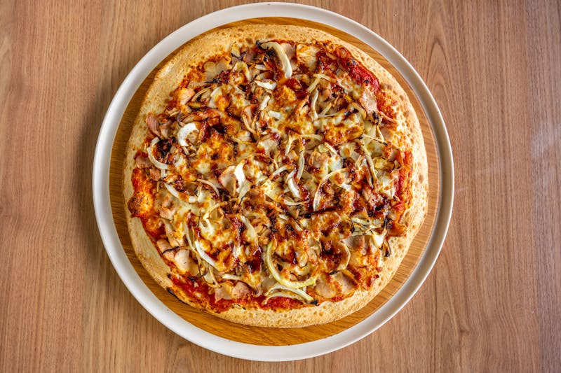 BBQ chicken pizza with red onion and cilantro