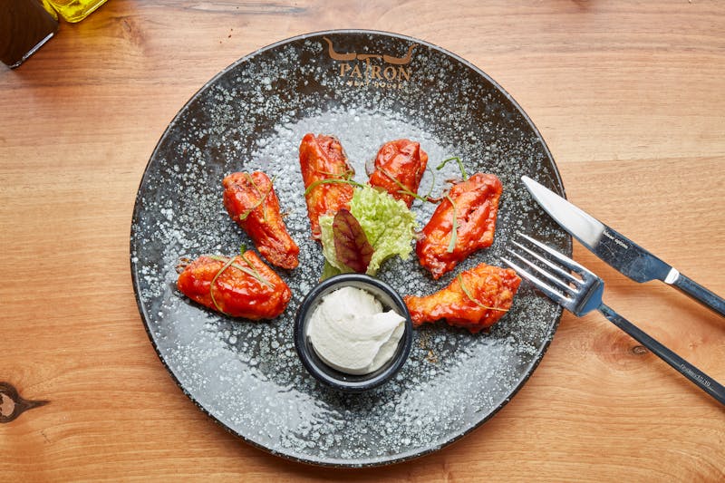 Buffalo chicken wings with hot sauce and blue cheese