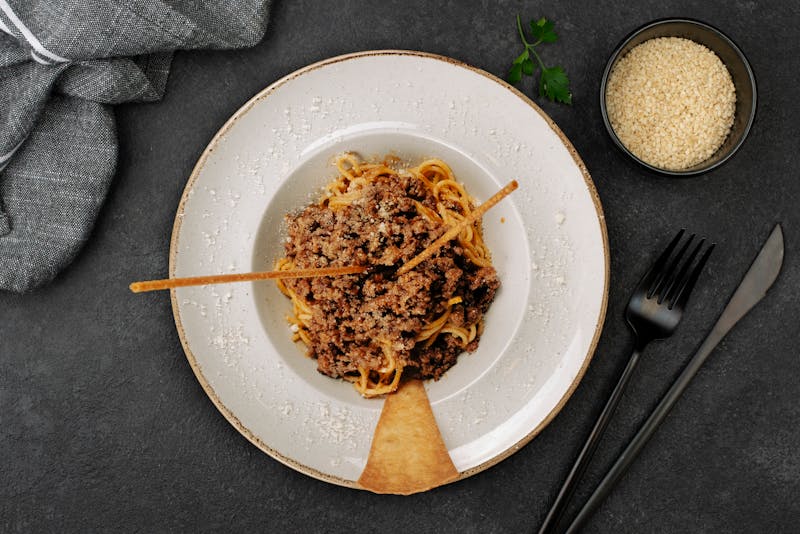 Spaghetti bolognese with rich meat sauce and parmesan